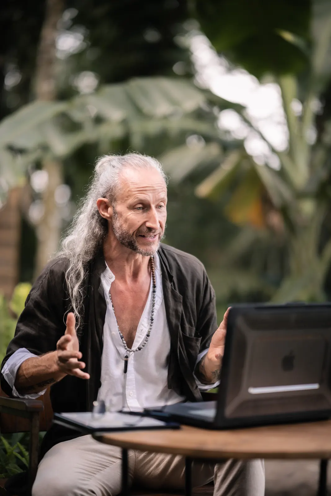 Steve Shiva working at an outdoor table in Bali
