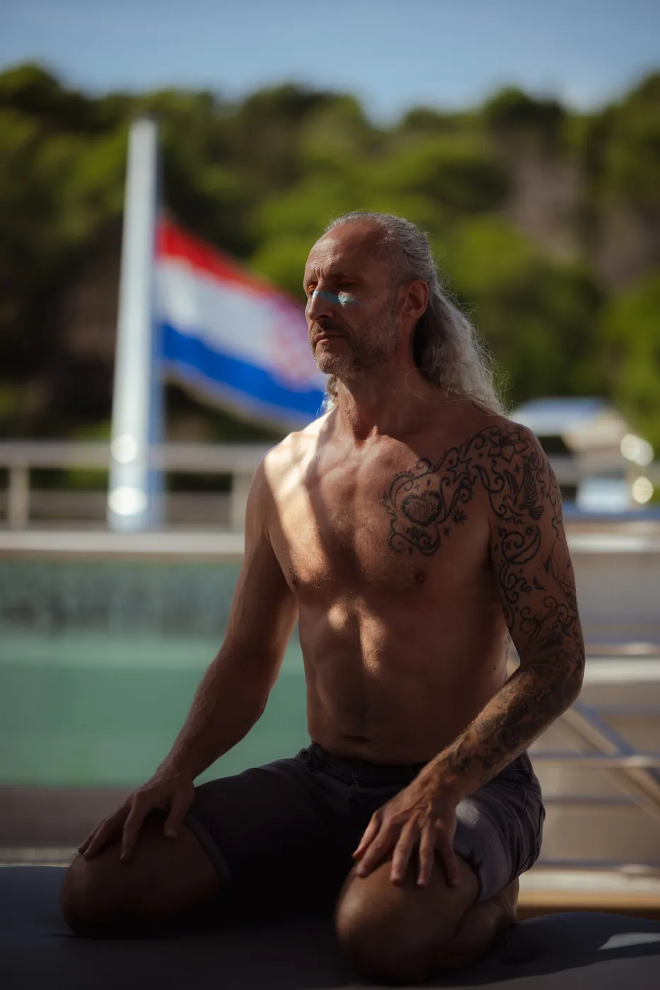 Steve kneeling on deck during the Tantra Yacht journey in Croatia