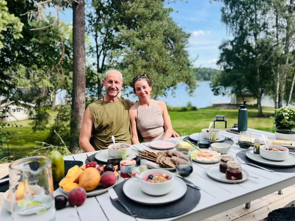 Steve and Amanda at a long retreat breakfast by the lake