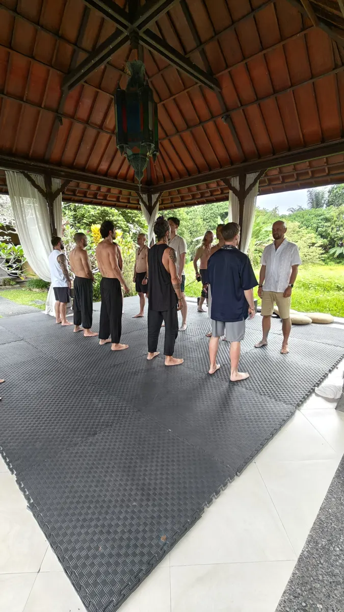 The men in line in the pavilion