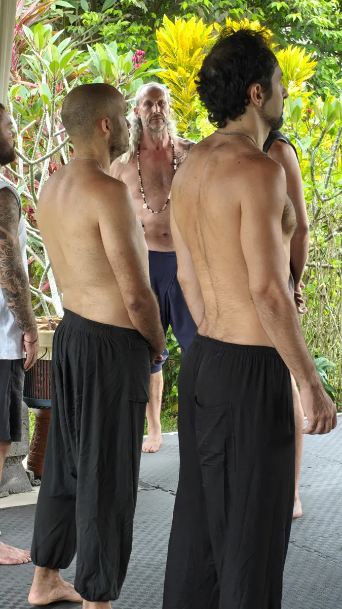 The men standing shoulder to shoulder