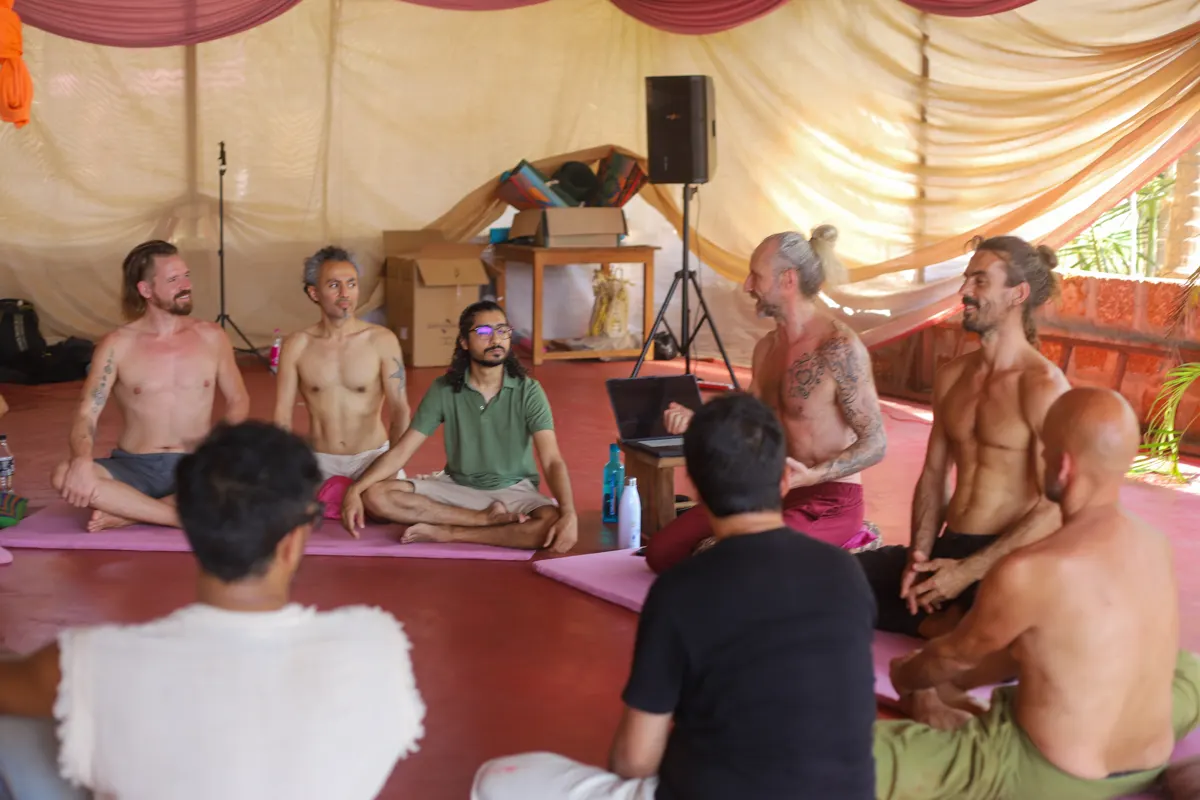 The men in circle in the shala