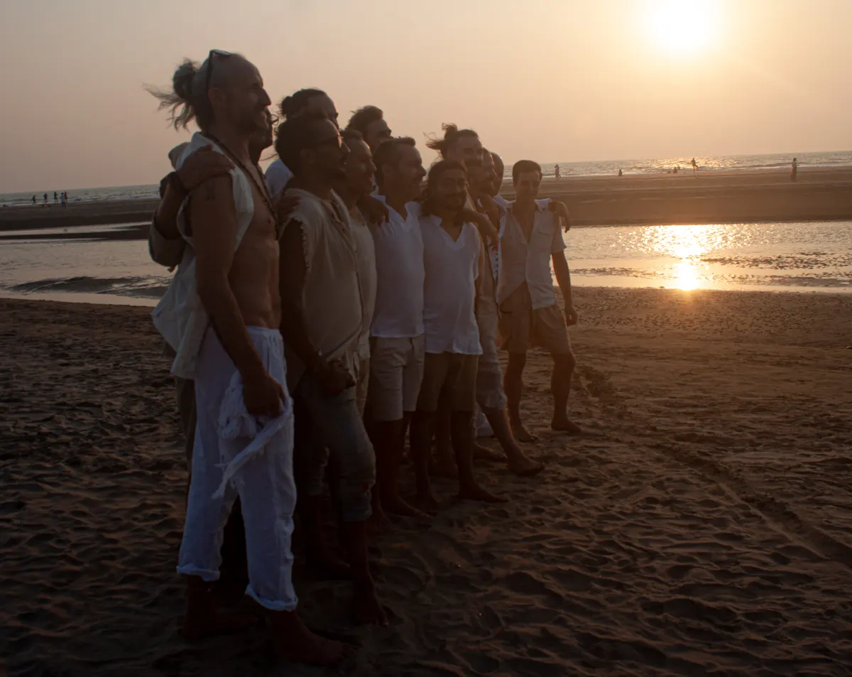 The men at sunset by the sea