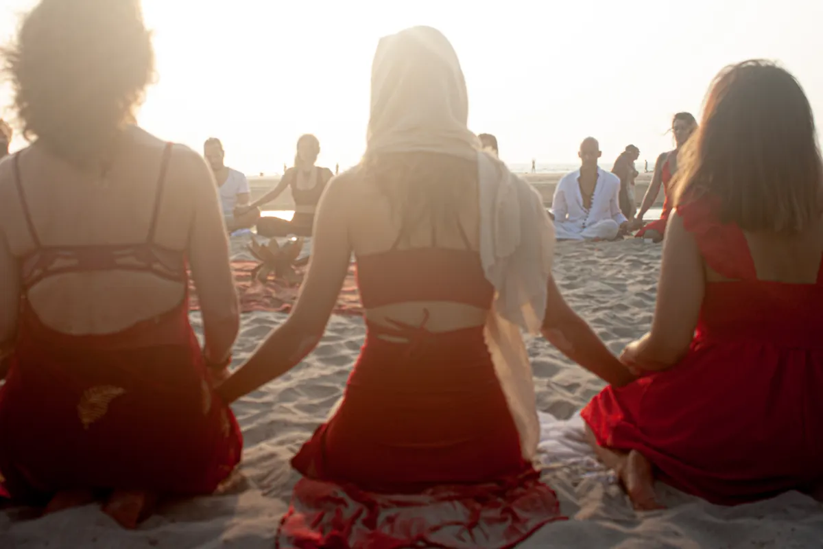 The women facing the sunset