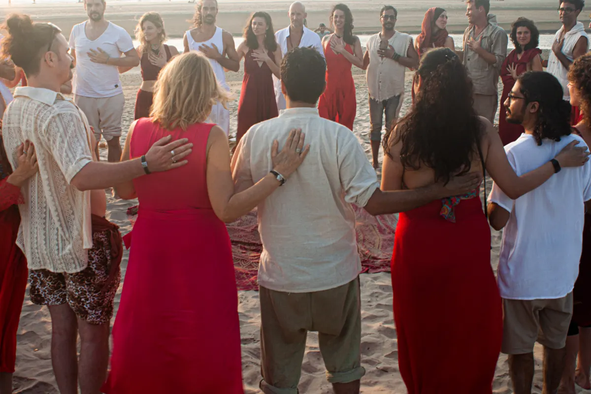 Men and women dancing on the beach
