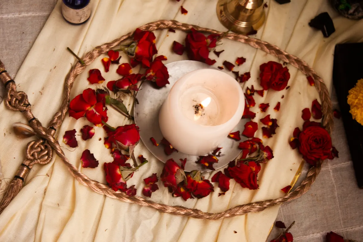 Roses and candle at the altar