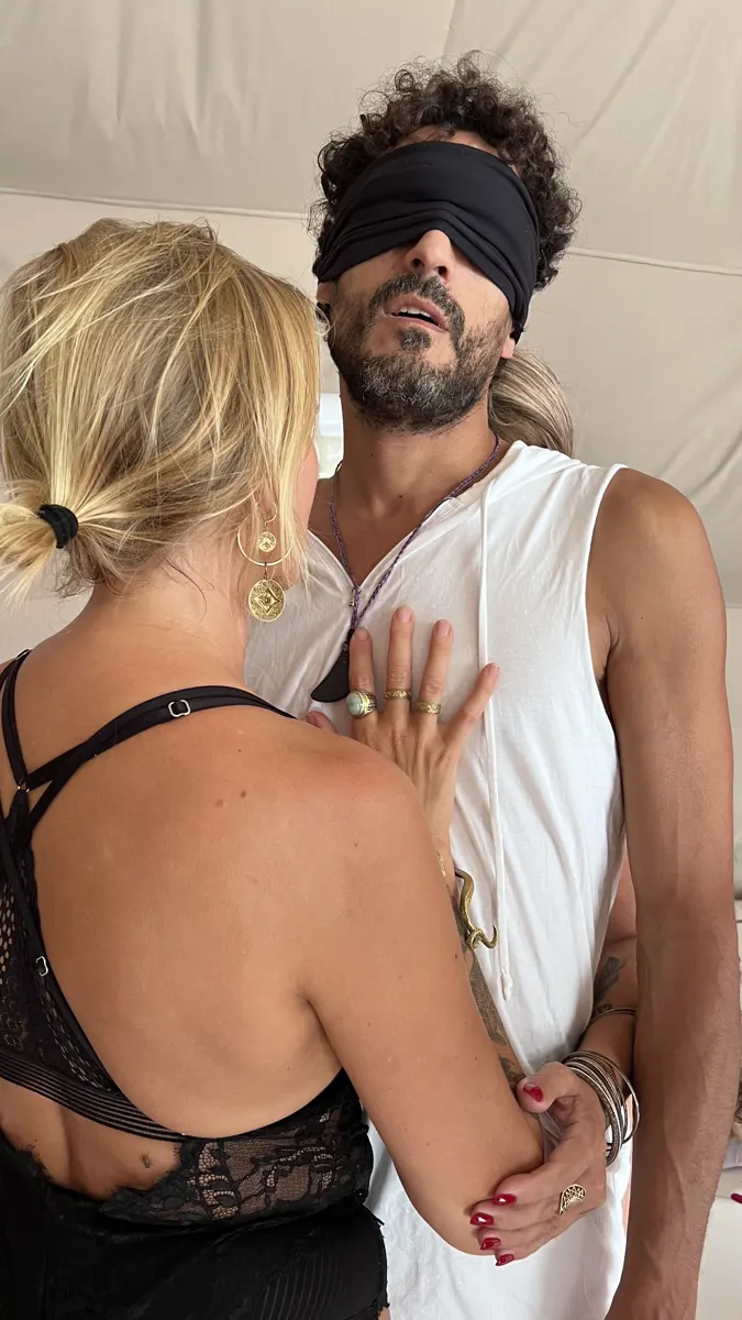 A blindfolded man meeting a woman