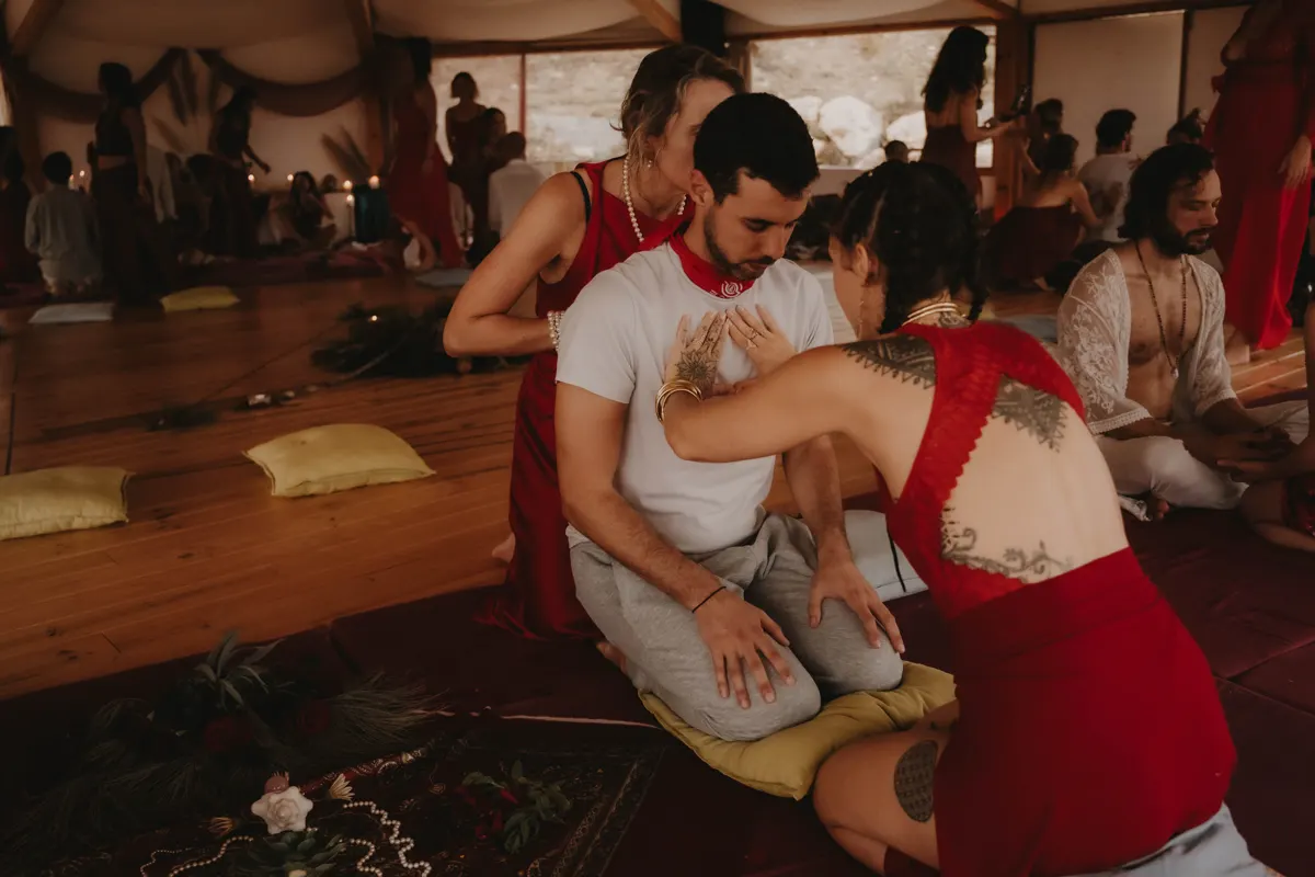 A woman in red holding a man in white
