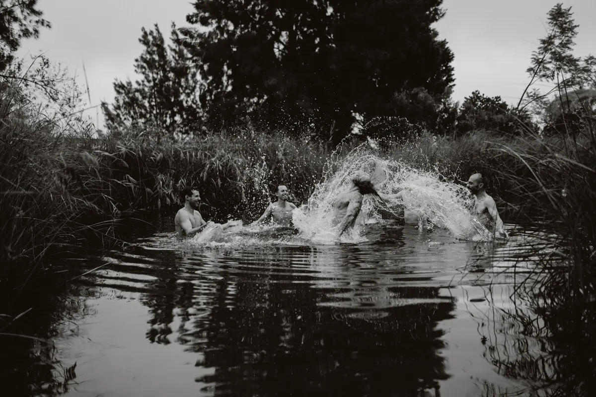 The men leaping into the river