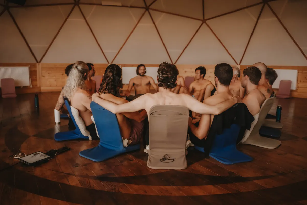 The men in circle on the floor