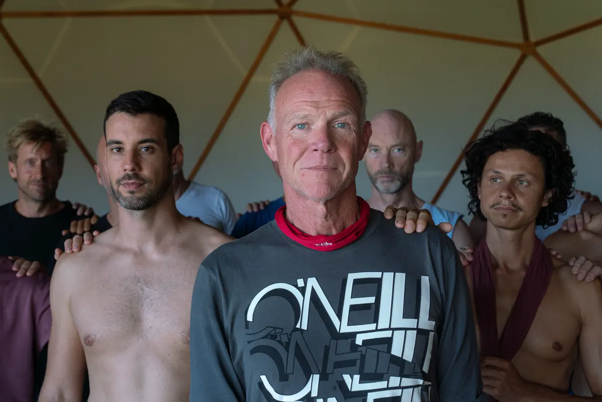 The men gathered behind a brother