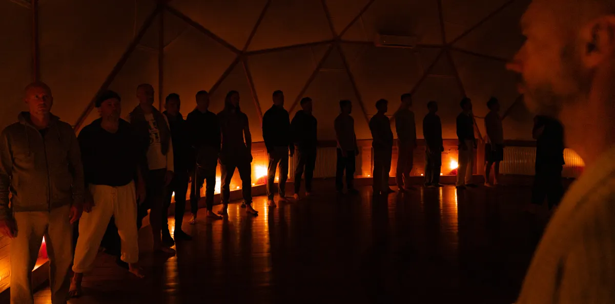 The men in a line of candlelight